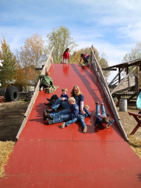 teachers and students playing together at the pumpkin patch